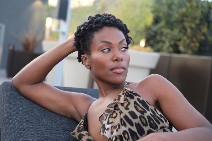 DeWanda Wise is posing for the photo.